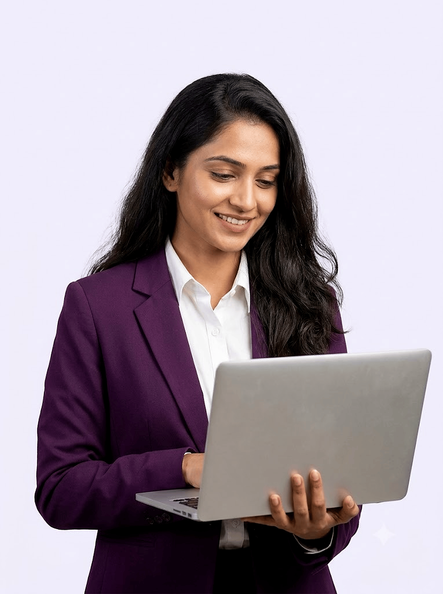 Smiling professional woman in a purple blazer holding a laptop
